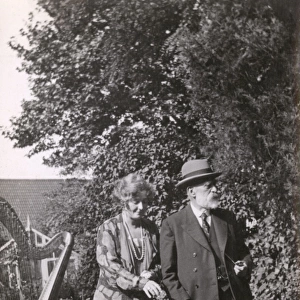 Couple with dog in the garden