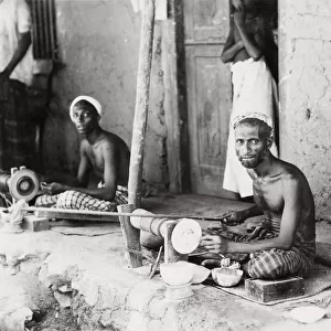 Craftsmen, wood turners at work on lathes, India