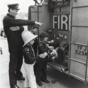 Cub Scouts cleaning fire engine