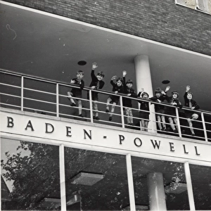 Cubs waving from Baden Powell House, London