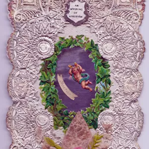 Cupid with ivy leaves on a paper lace romantic card