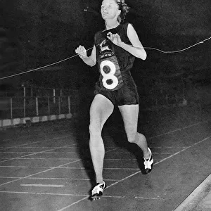 Diane Leather winning the mile race
