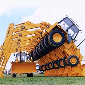 Display of JCB Extradig diggers in a field