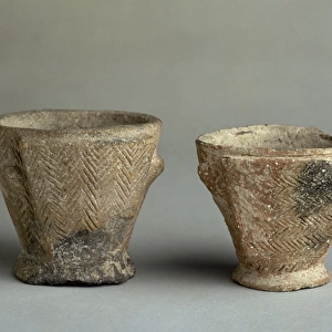 Double-bottomed cups with geometric incision. 700-301 BC