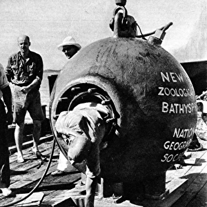 Dr. Beebe climbing out of his bathysphere, August 1934
