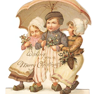 Three Dutch children on a cutout Christmas card