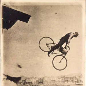 Edward Reddish riding his bicycle off Worthing Pier