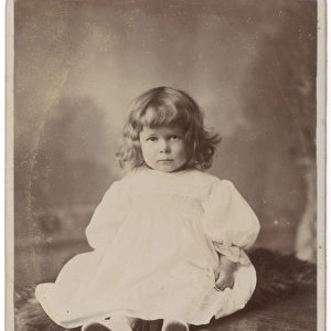 Edwardian girl sitting on a table