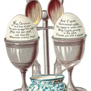 Eggcup stand with two eggs on a cutout Christmas card Eggcup stand with two eggs on a cutout Christmas card
