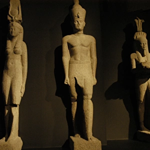 Egyptian art. Colossal statues of a pharaoh, his wife and th