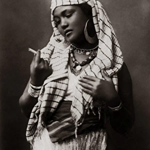Egyptian girl with cigarette, Egypt, circa 1910