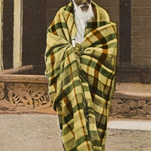 Elderly Maori man wrapped in a blanket