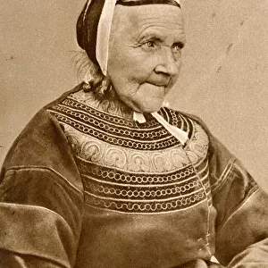 Elderly woman in traditional costume, France
