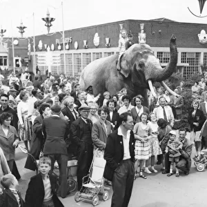 An elephant with holidaymakers at Butlins, Filey