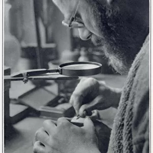 Eric Gill, sculptor and printmaker, at work