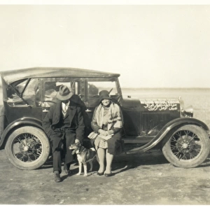 European couple with dog and car, Middle East