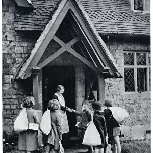 Evacuees receive their kit bags in the country 1939
