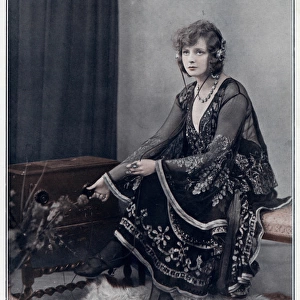 Evelyn Laye listening to music in 1923