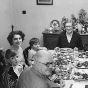 Extended family eating Christmas Dinner