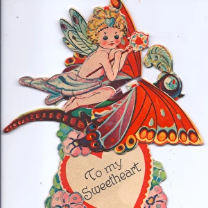 Fairy riding a butterfly on a movable Valentine card