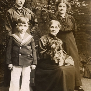 Family of four with a dog in a garden