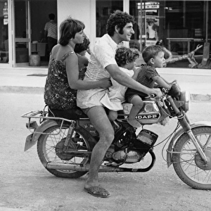 Family of five on a motorcycle in Rhodes, Greece