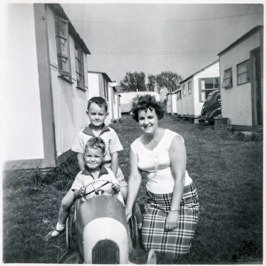 Family pose for the camera at a British holiday camp
