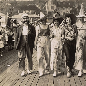 Fancy dress on a seaside pier, c. 1930
