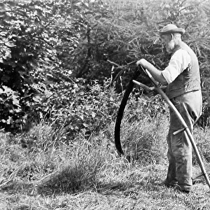 Farmer using a scythe Victorian period