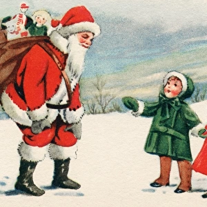 Father Christmas with two small children in the snow