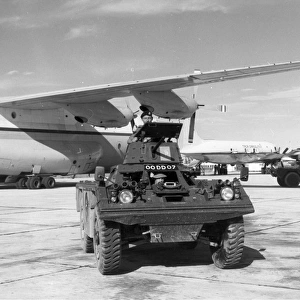 A Ferret armoured scout car at Belize with a RAF Short SC-5