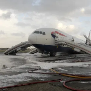 Fire crews attend the aftermath of a plane crash