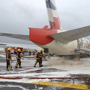 Fire crews attend the aftermath of a plane crash