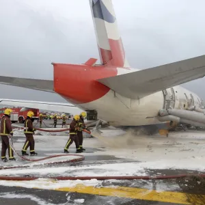 Fire crews attend the aftermath of a plane crash