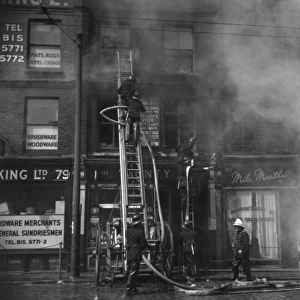 Firefighters in action in Commercial Road, East London