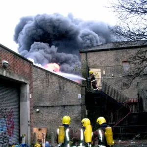 Firefighters at the scene of a warehouse fire, SE London Firefighters at the scene of a warehouse fire, SE London