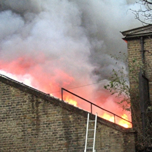 Firefighters at the scene of a warehouse fire, SE London