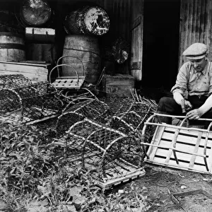 Fisherman making and repairing lobster pots