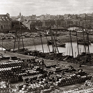 Fishing boats and barrels in the harbour at Wick, Scotland