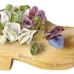 Flowers in a wooden clog-shaped Christmas card Flowers in a wooden clog-shaped Christmas card