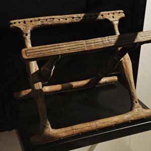 Folding chair in ash wood. Second half of 1400 BC. Bronze Ag