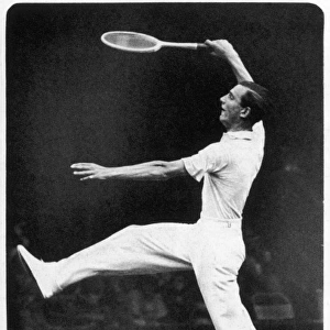 Fred Perry returning a serve