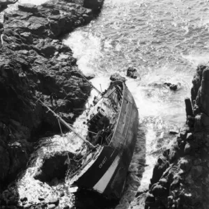 French fishing boat on rocks, Dollar Cove, Cornwall