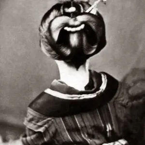 Geisha showing an ornate hairstyle and obi sash, Japan, circa 1880s Geisha showing an ornate hairstyle and obi sash, Japan, circa 1880s