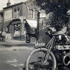 Gentleman on his circa 1918 Douglas motorcycle
