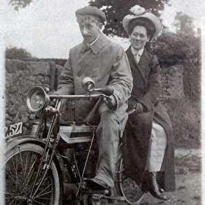 Gentleman & lady on a 1910 Triumph motorcycle