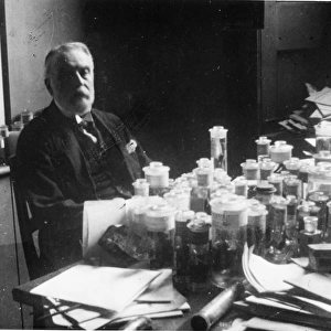 George Albert Boulenger (1858-1937) with spirit jars, 1920s