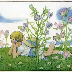 Girl with a baby fairy lying in the garden in summer