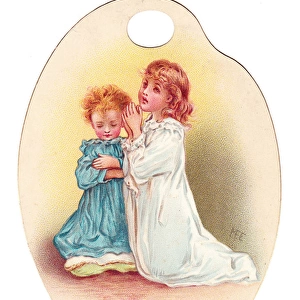 Girl and boy praying on a palette-shaped greetings card