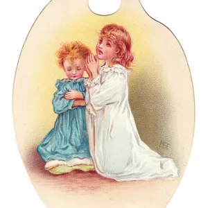 Girl and boy praying on a palette-shaped greetings card